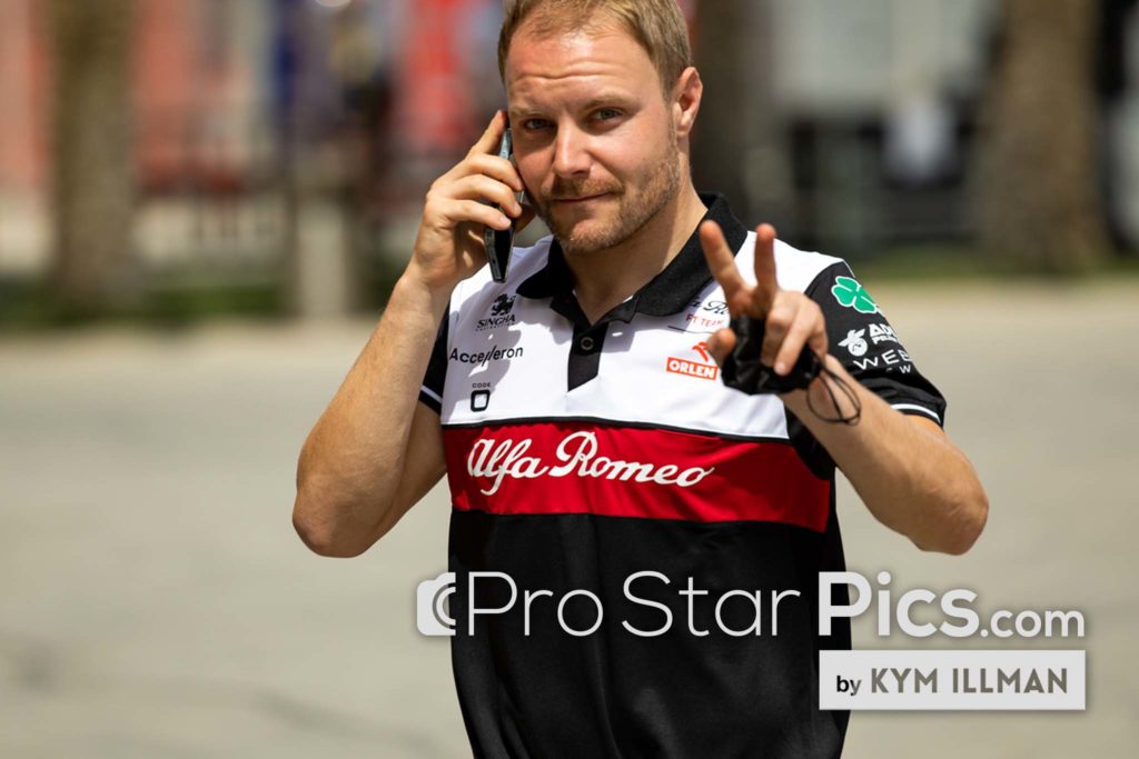 Formula-1-Valtteri-Bottas-Alfa-Romeo-driver-on-Phone