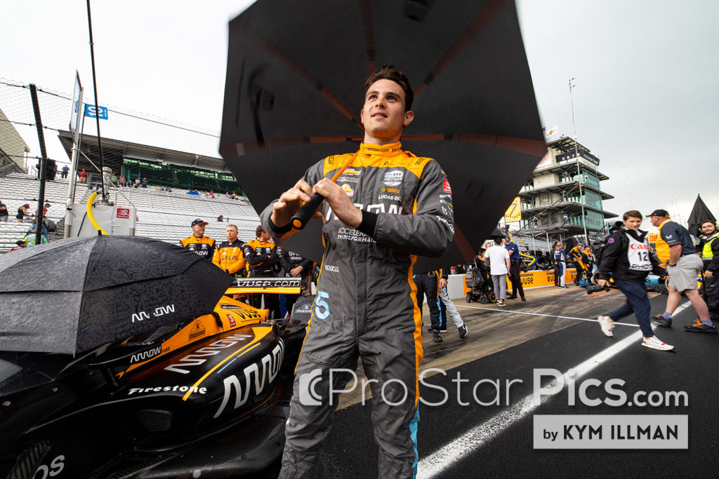 pato-o-ward-holding-umbrella-Indianapolis-motor-speedway-grid 