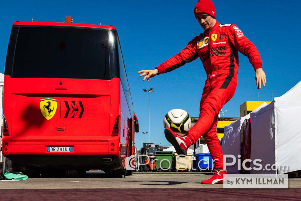 Ferrari f1 driver Charles leclerc playing soccer with his trainer