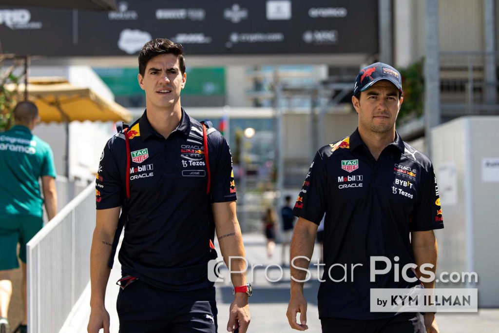 Sergio Perez' F1 trainer Jose Canales walking through F1 paddock