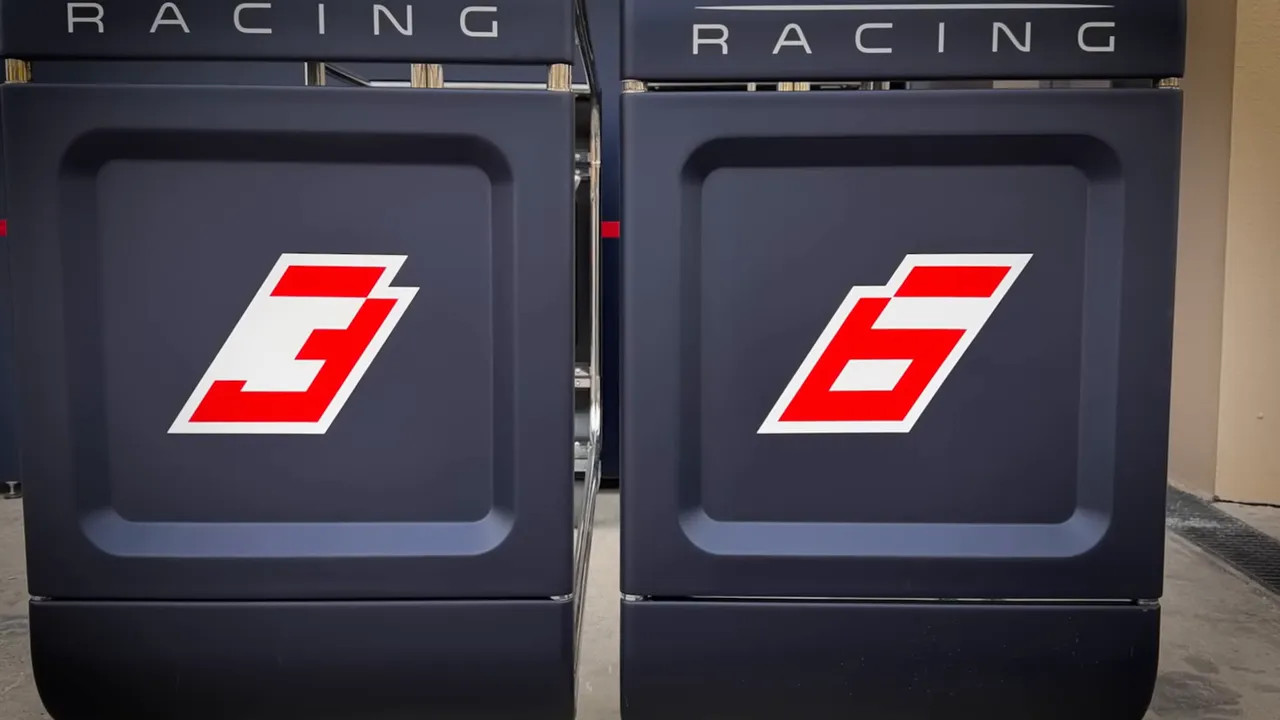 Close-up of pit garage cabinets showing car numbers 3 and 6