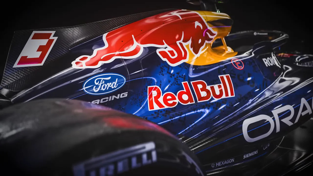 Close-up of Red Bull F1 car side showing glossy blue livery, Red Bull and Ford Racing logos and the number 3