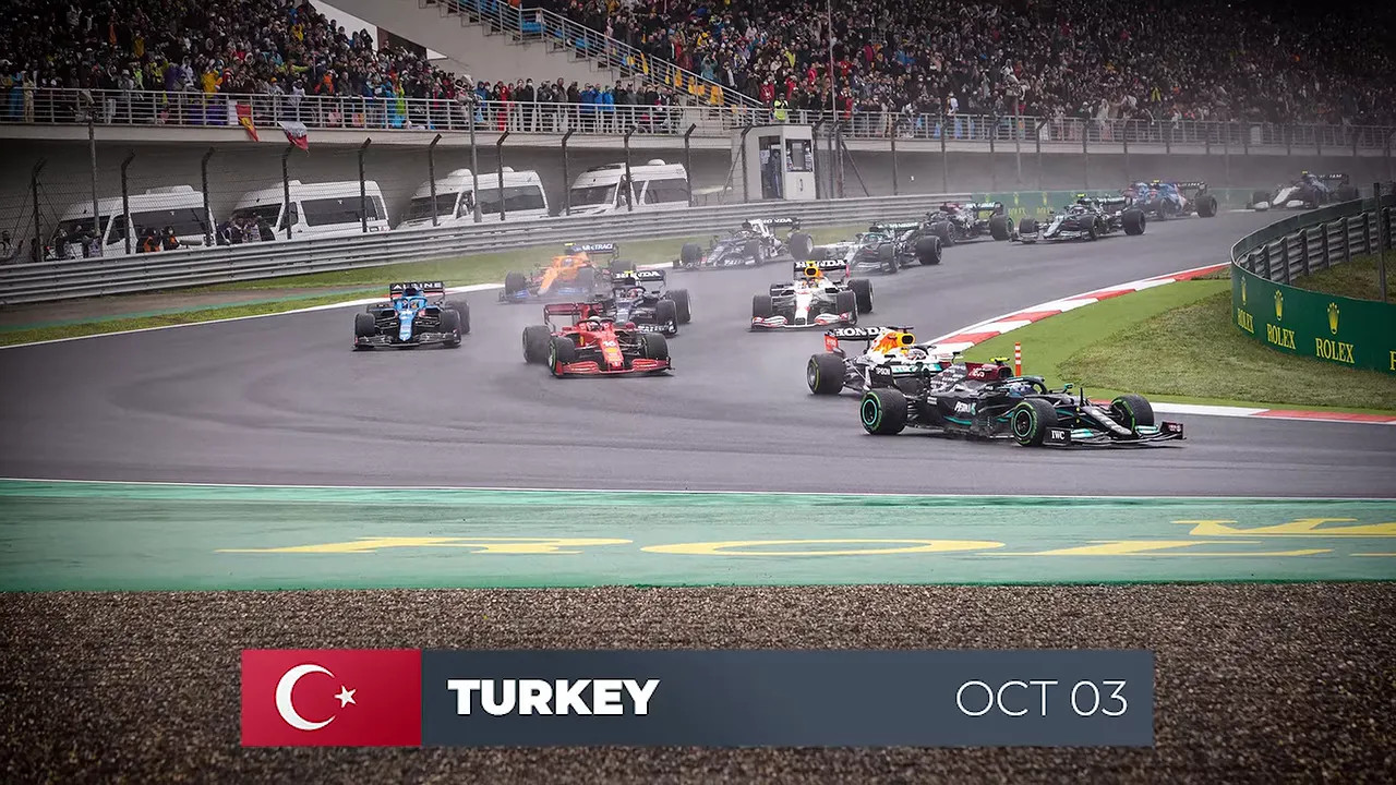 Formula 1 cars racing in wet conditions at Istanbul Park with Turkey October 3 graphic