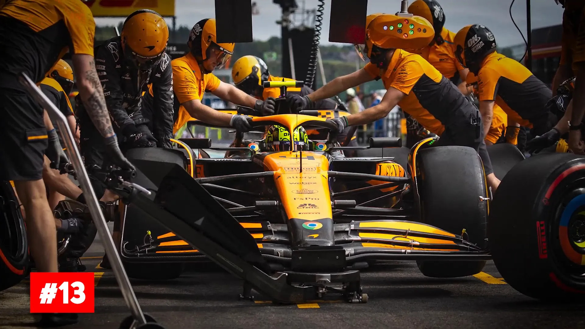 Pit crew performing a rapid tyre change during a race