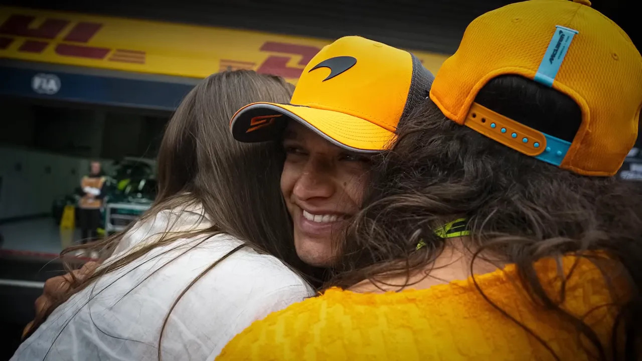 Family members and partners in garage showing emotions