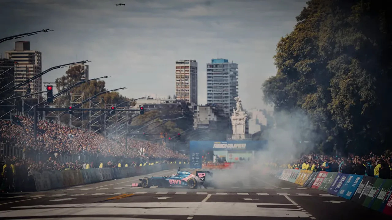 Mercedes car on the Miami circuit with smoke and packed grandstands in the 2026 Miami Grand Prix