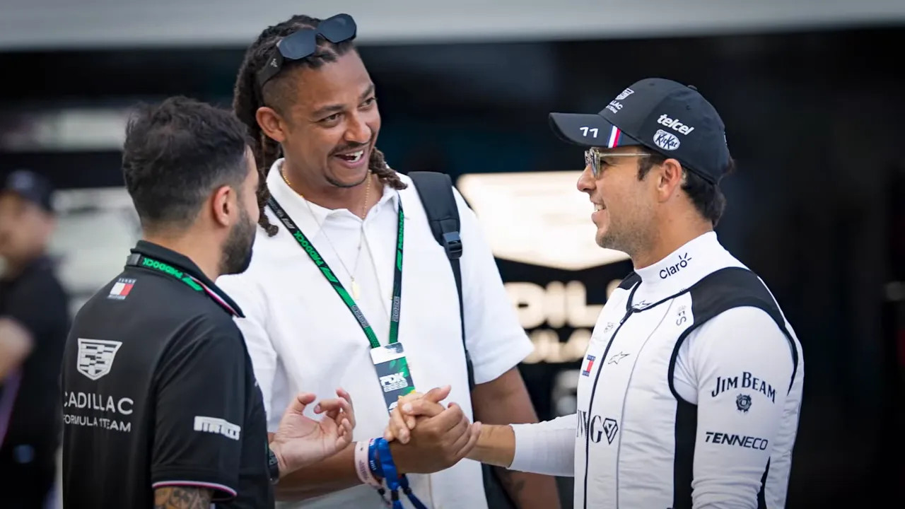 Mercedes team members speaking in the paddock at the 2026 Miami Grand Prix