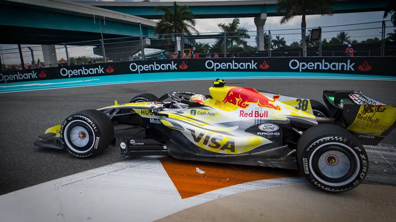 Red Bull car passing a trackside barrier at Miami GP
