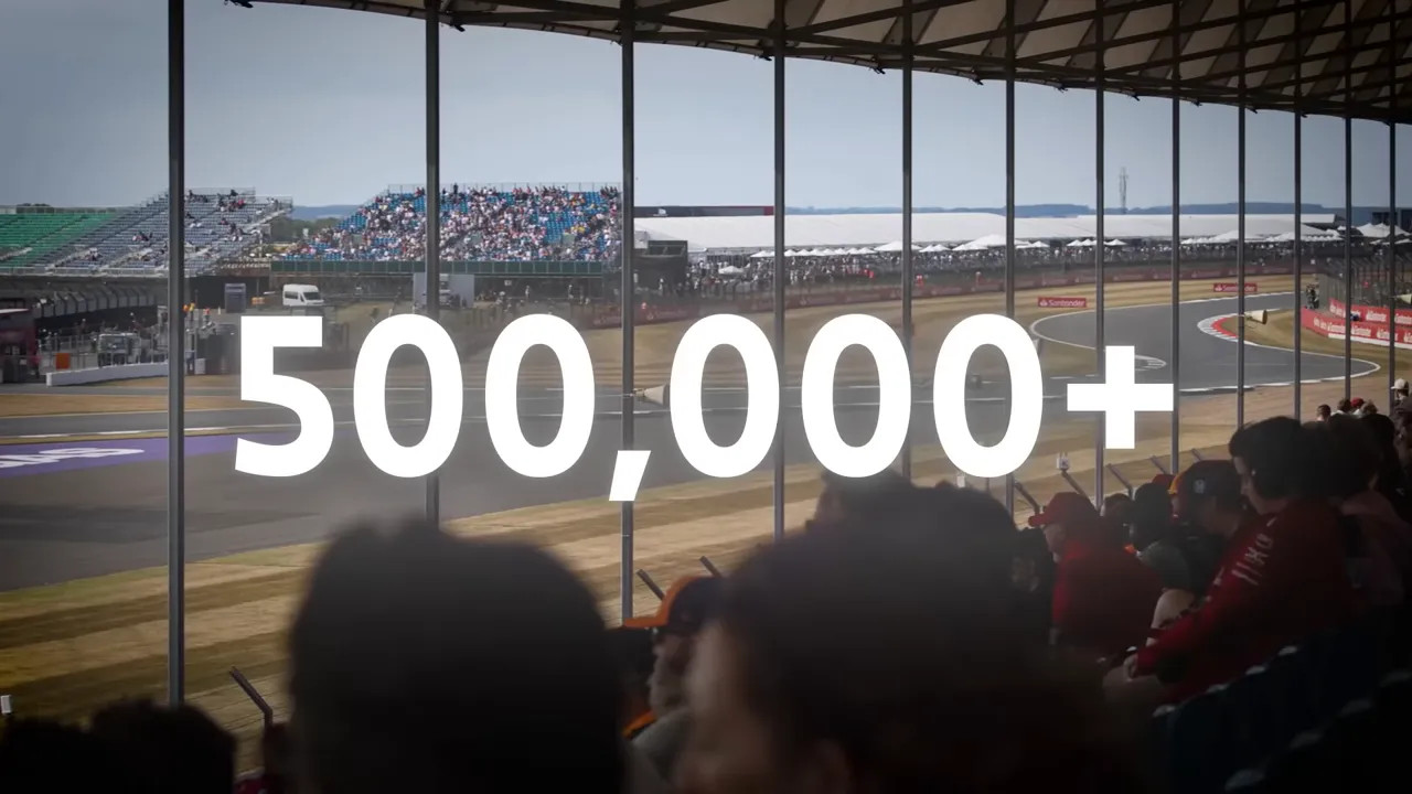 Grandstand view of track with large white text reading 500000 plus