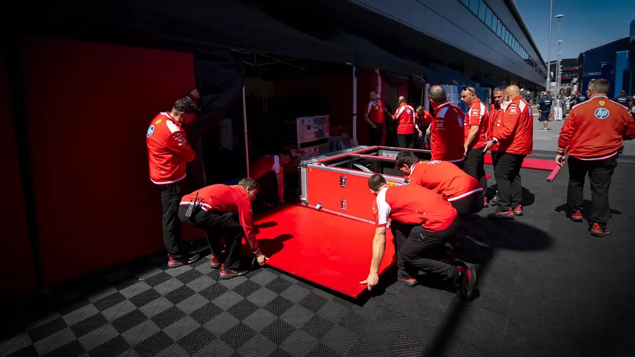 Large red Ferrari wall panel standing alone after equipment around it was removed