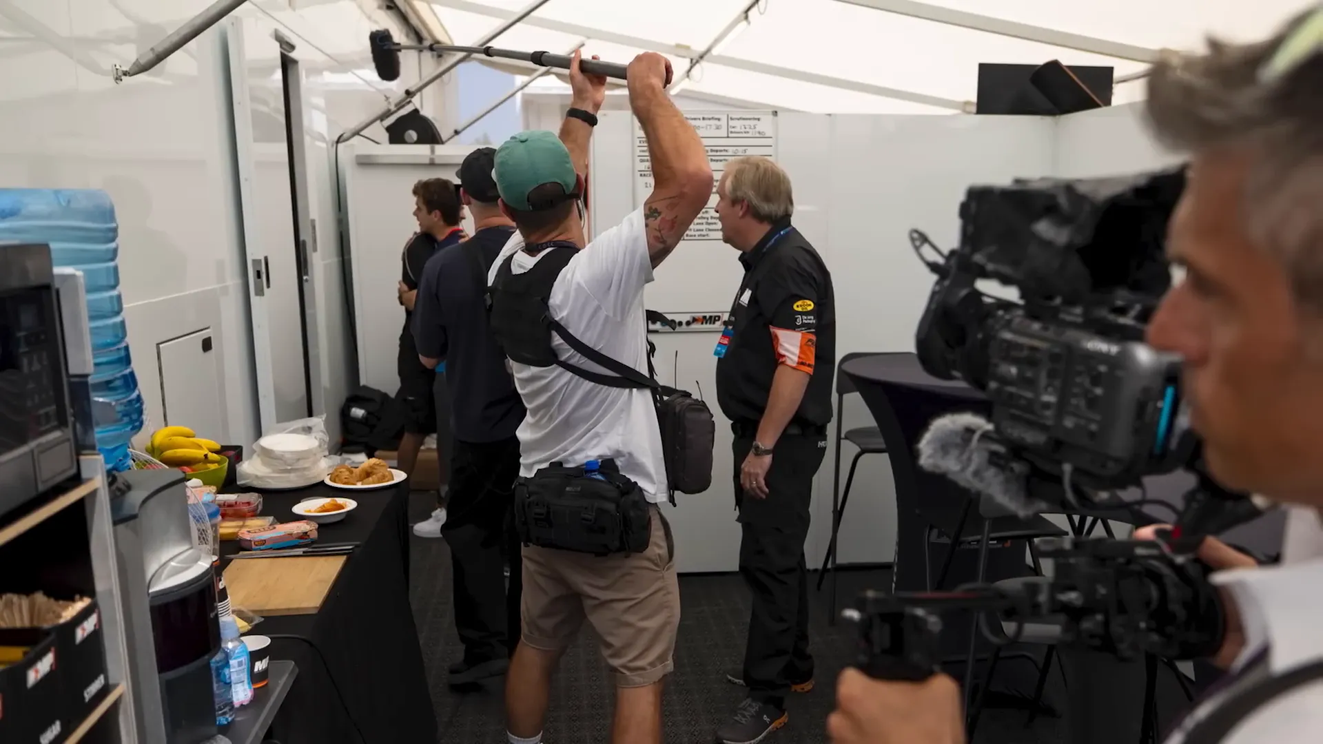 Producers discussing footage with teams