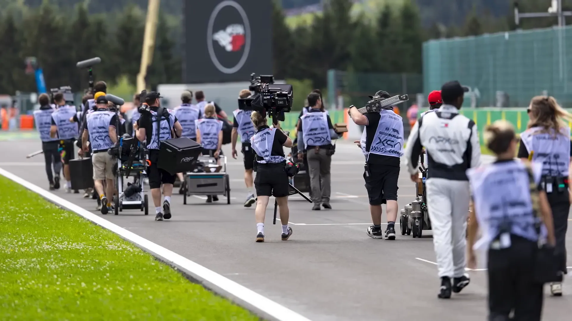 Production team filming during a race