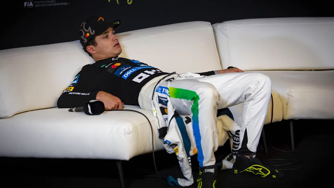 Lando Norris slumped on the couch during the press conference