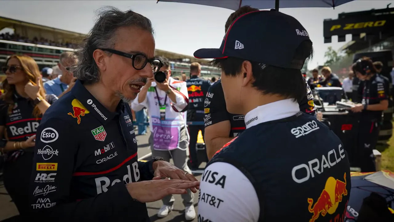 Laurent Mekies discussing setup with Max Verstappen in the garage