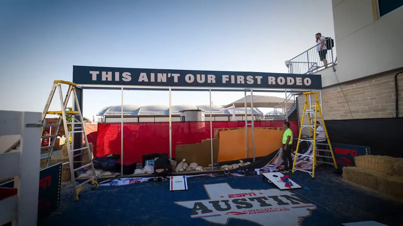 Wind-affected signage behind the media centre at Austin