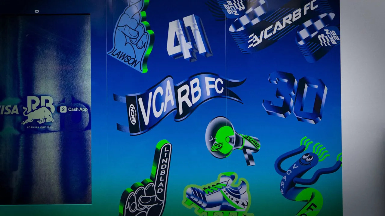 blue wall display with VCARB FC graphics including soccer ball shirt and number 41