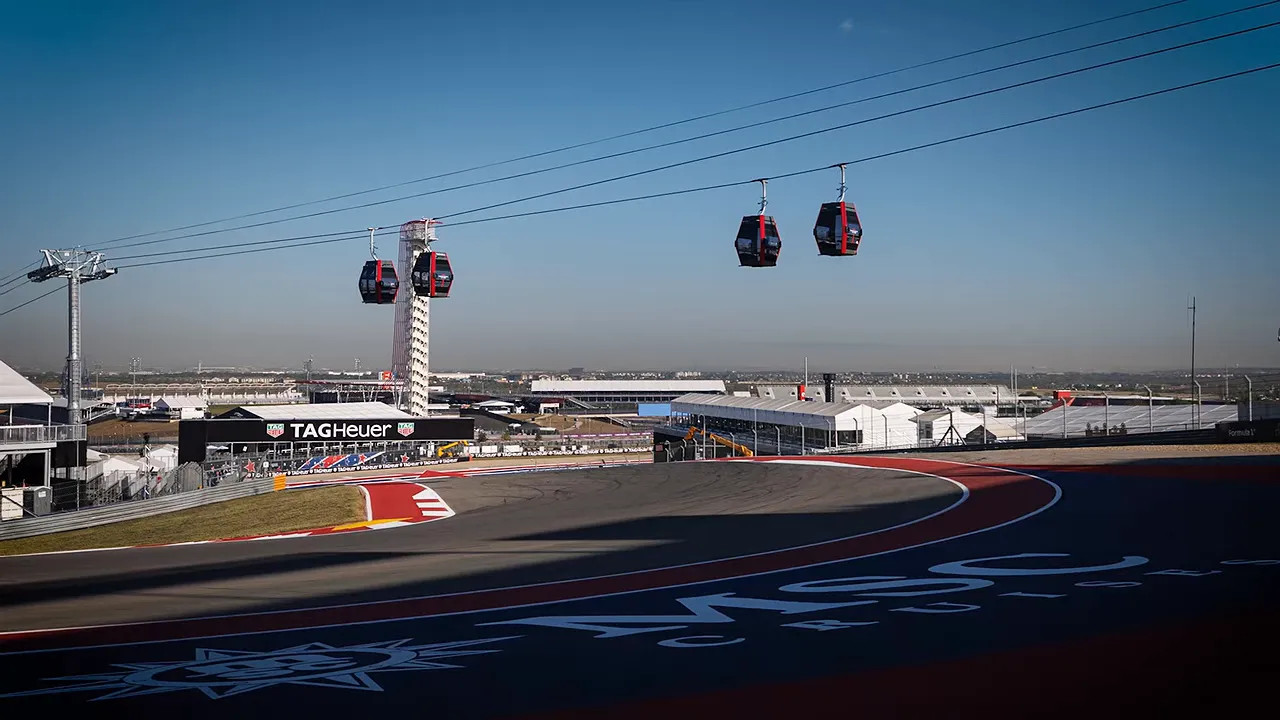 Gondola cabins suspended above the Circuit of the Americas track