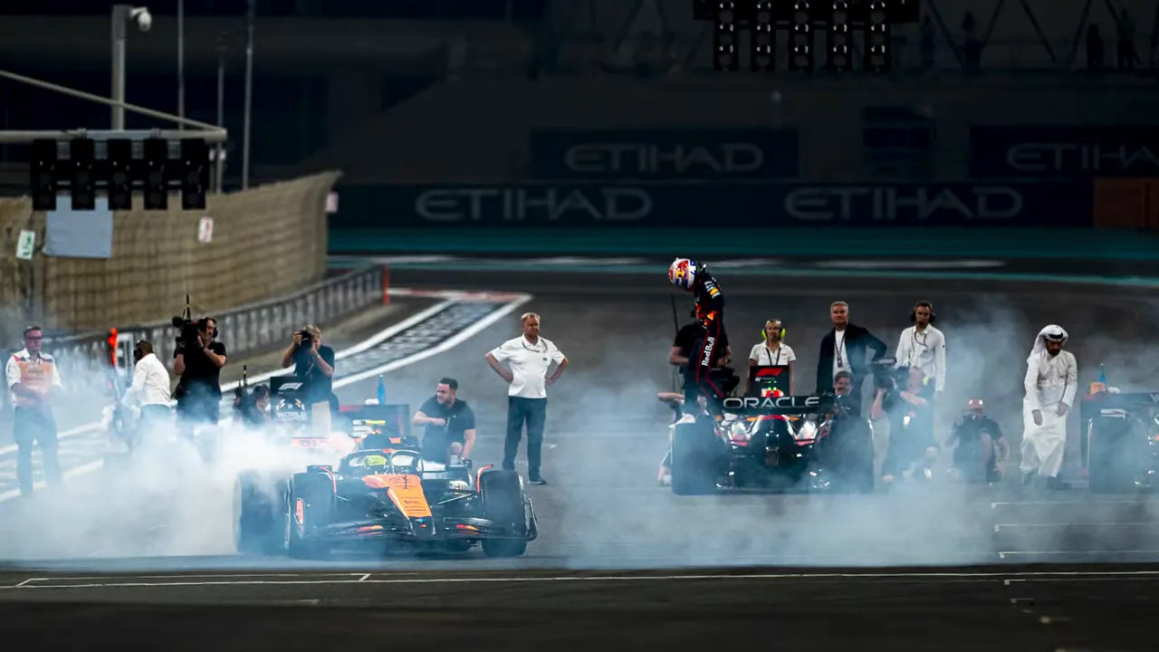 Night race start grid at Qatar with illuminated pit buildings