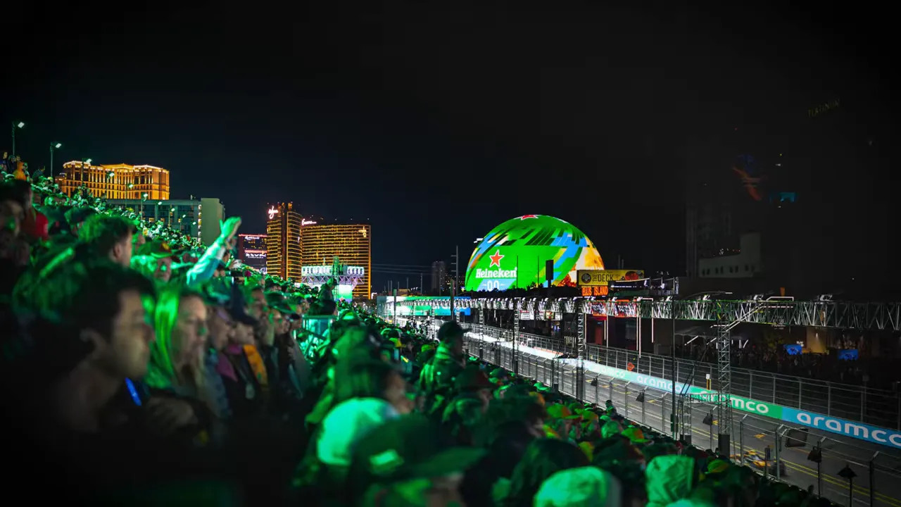 Las Vegas Grand Prix night atmosphere with crowds along the circuit and Heineken globe