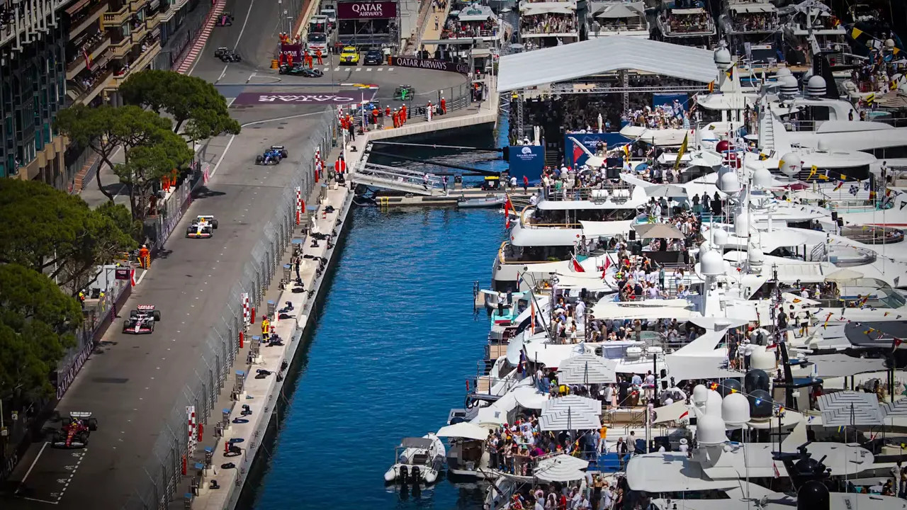 Aerial view of Monaco harbour beside the race circuit with tightly packed yachts