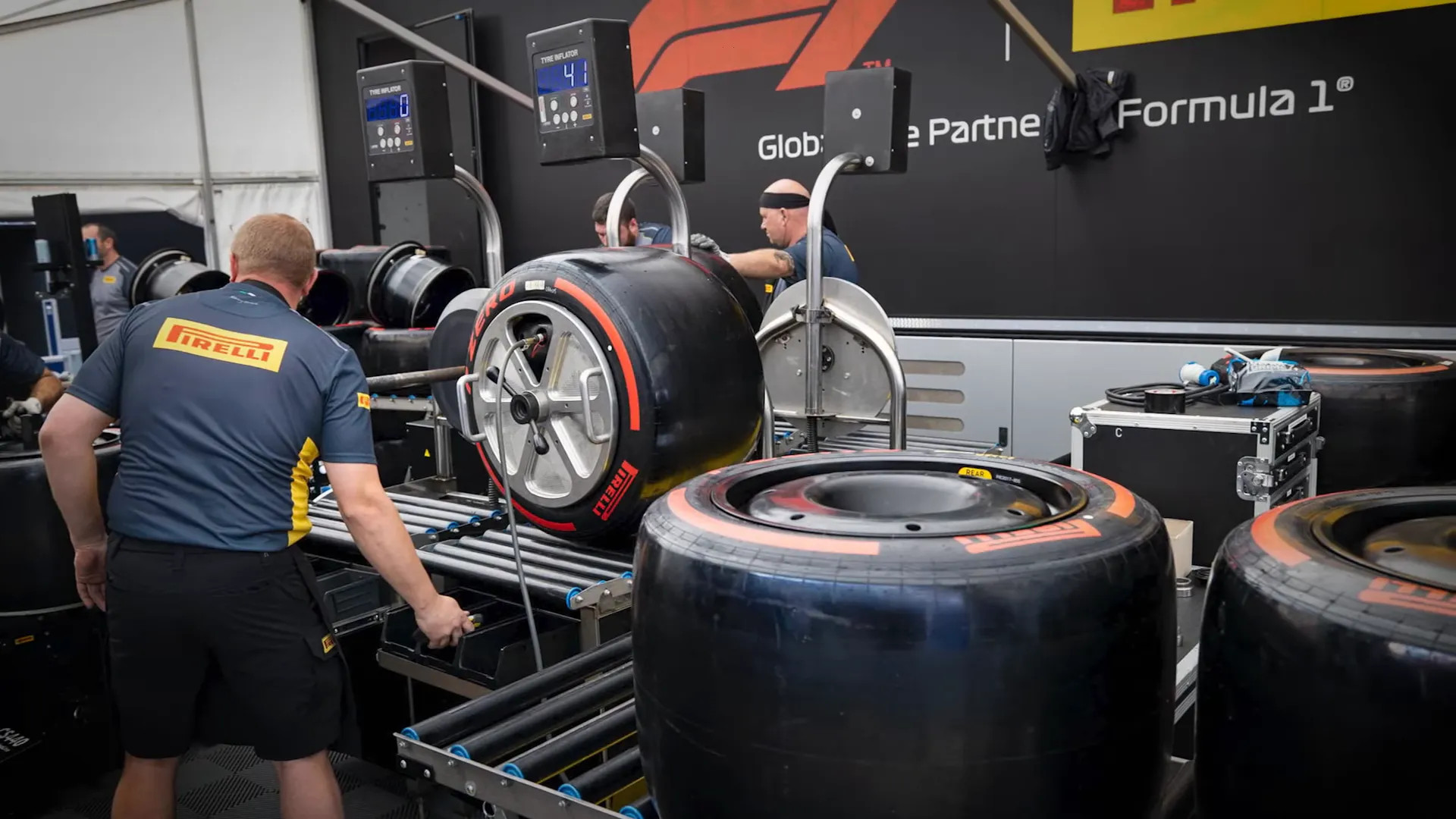 Pirelli trucks carrying slicks, wets and spare tyres arrive at the paddock
