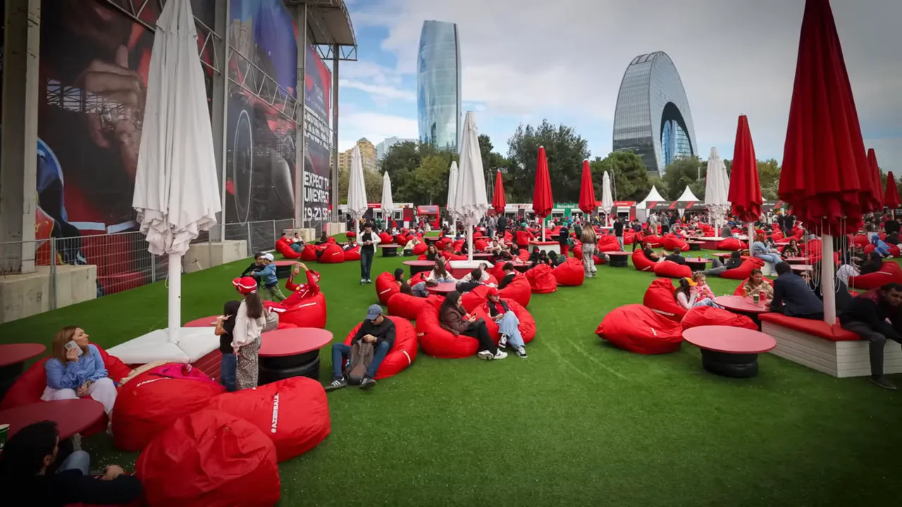 Empty fan zone with beanbag seating opposite the paddock