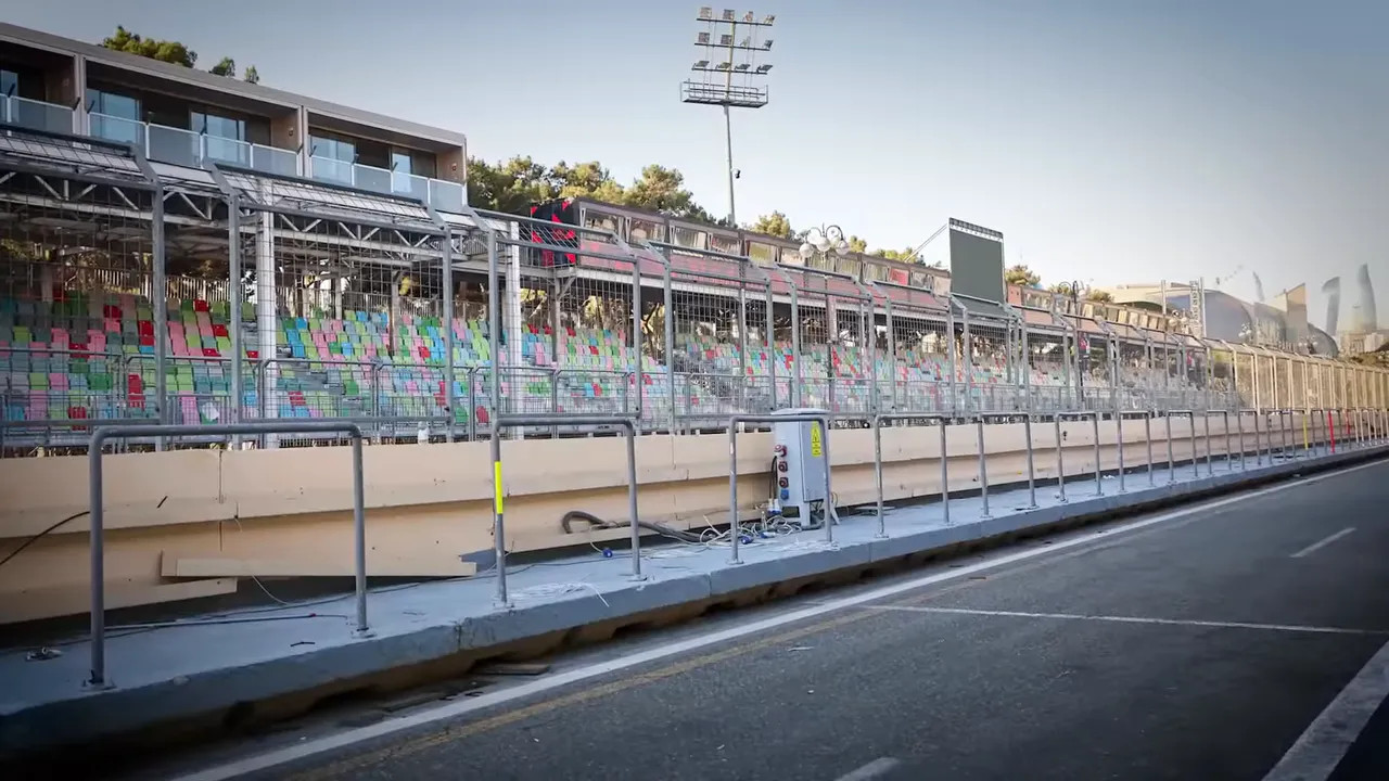 Empty pit lane and pit wall barriers still in place on Baku's street circuit