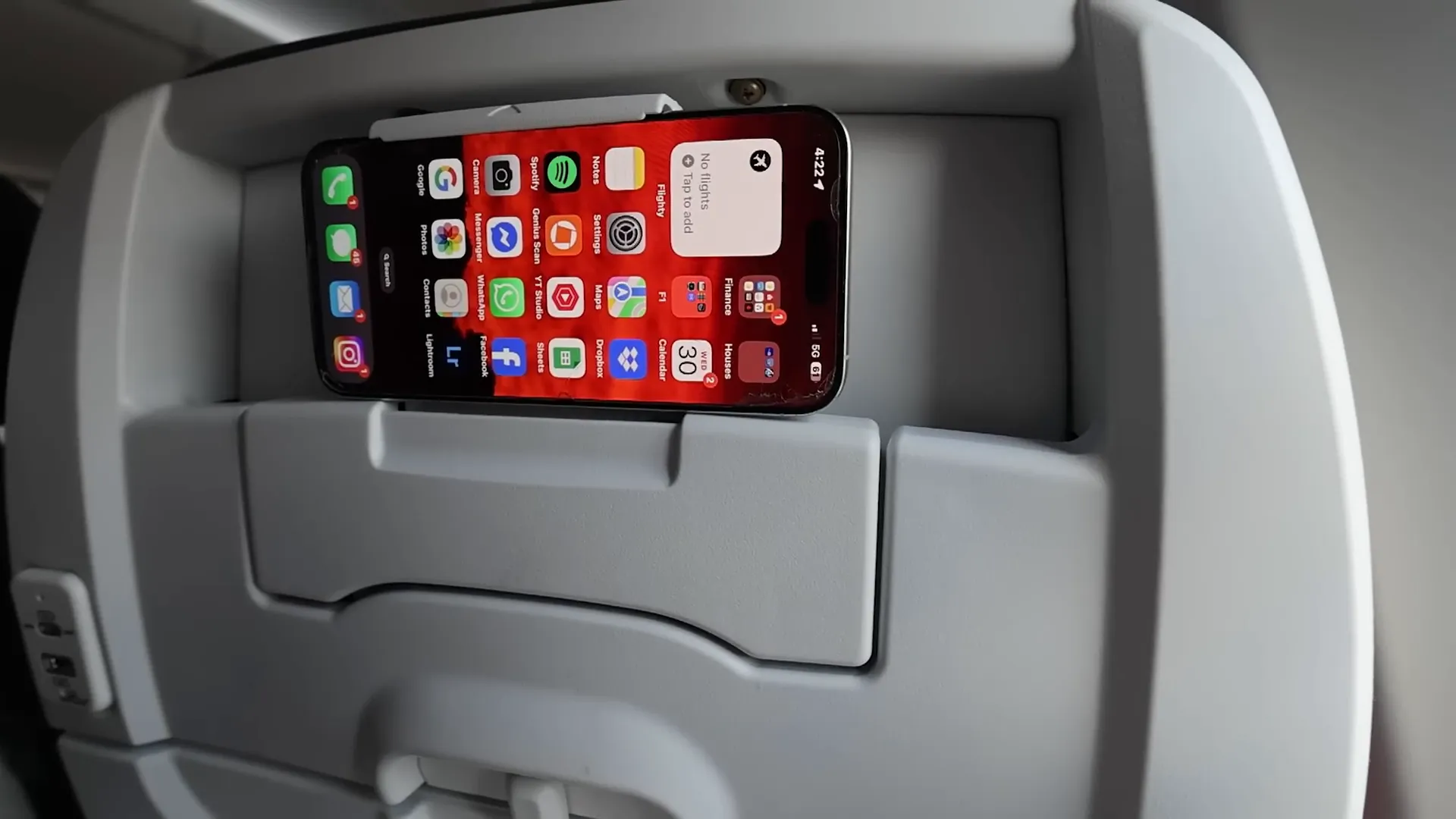 Business class seat with USB-C charging point and phone holder