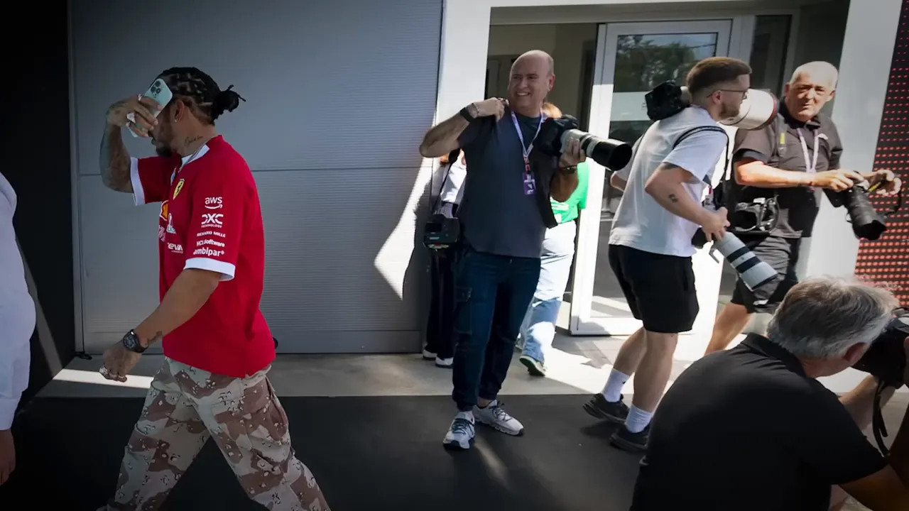 Lewis Hamilton navigating behind hospitality suites