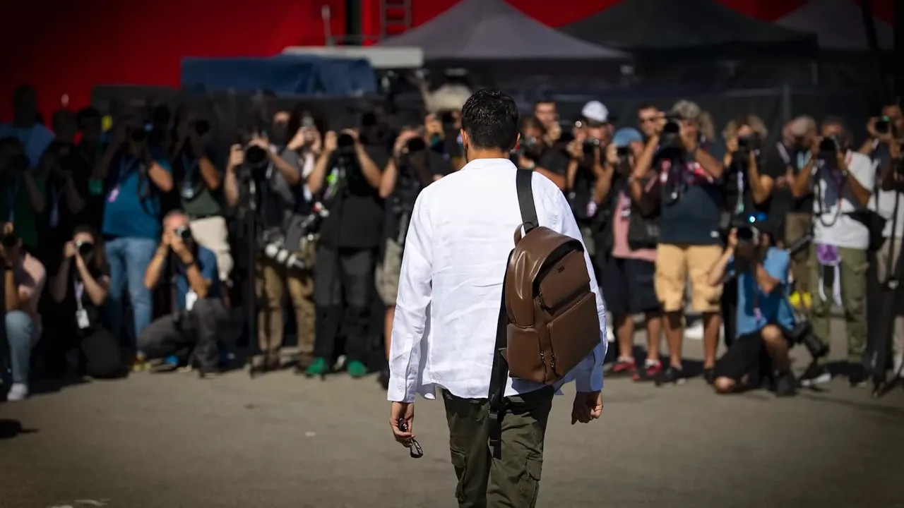 Photographer capturing a candid paddock moment