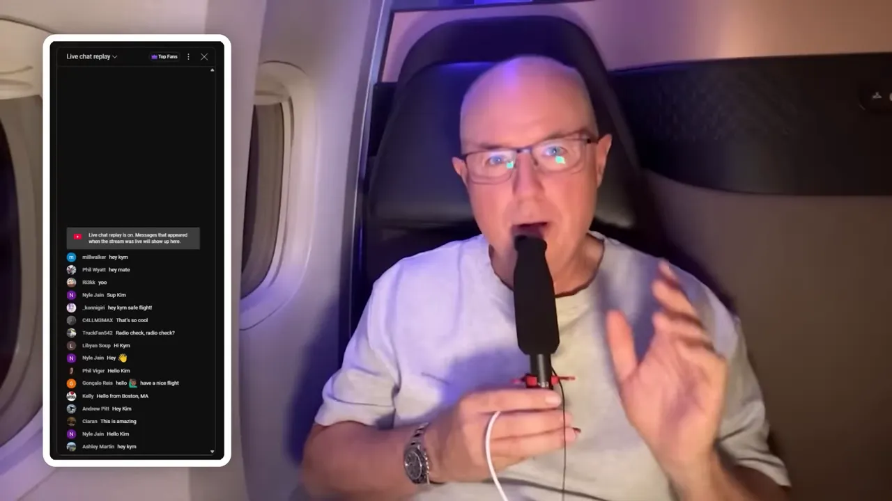 Presenter in an airplane Qsuite holding a microphone with a live chat overlay visible on screen