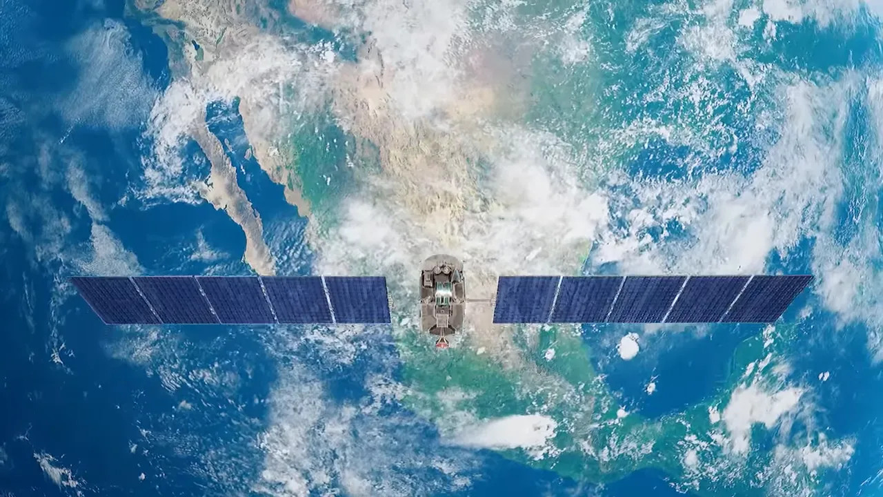 Satellite with solar panels orbiting above Earth, showing low-earth-orbit perspective