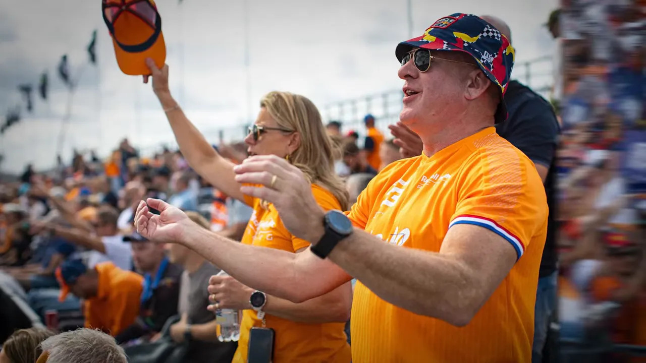 Large Dutch Grand Prix crowd waving red white and blue flags