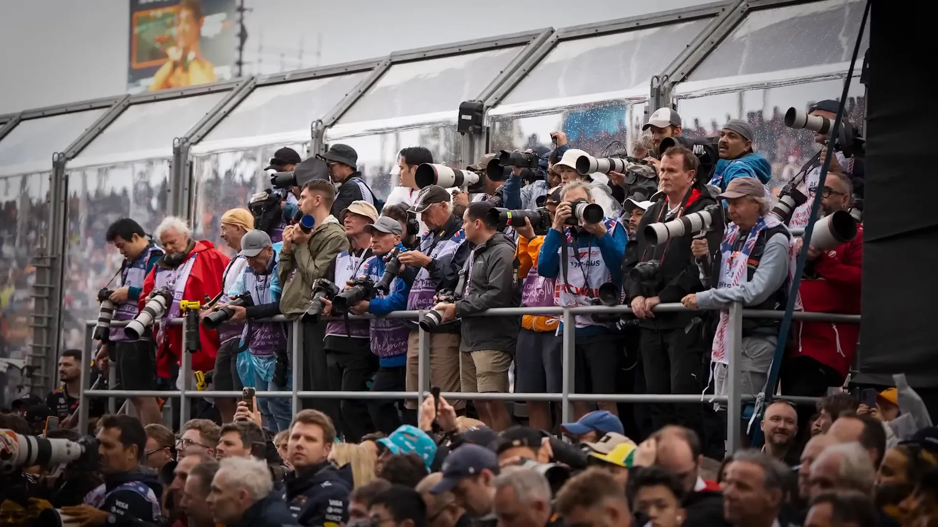 Crowd of photographers at an F1 race track