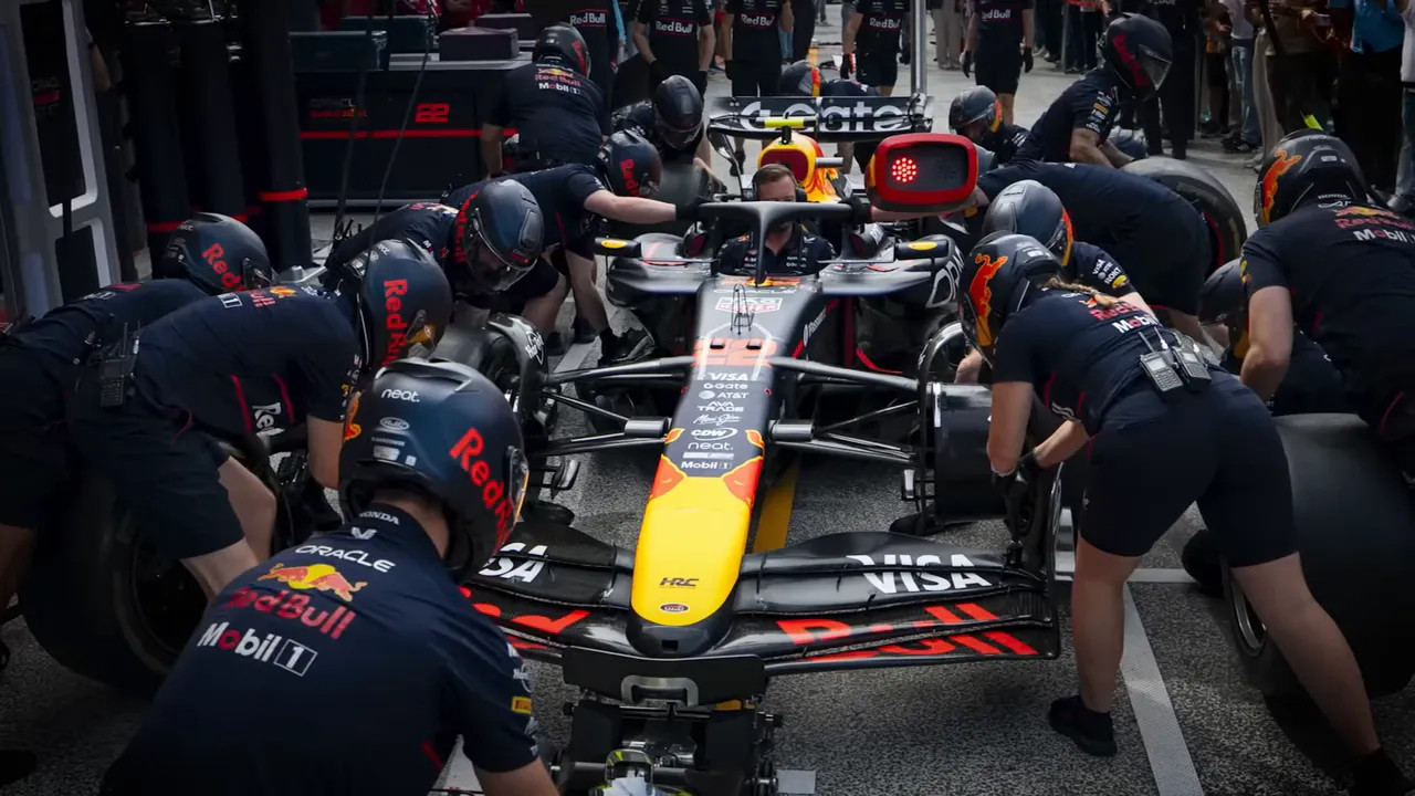 Pit stop action showing the intensity of the crew at work