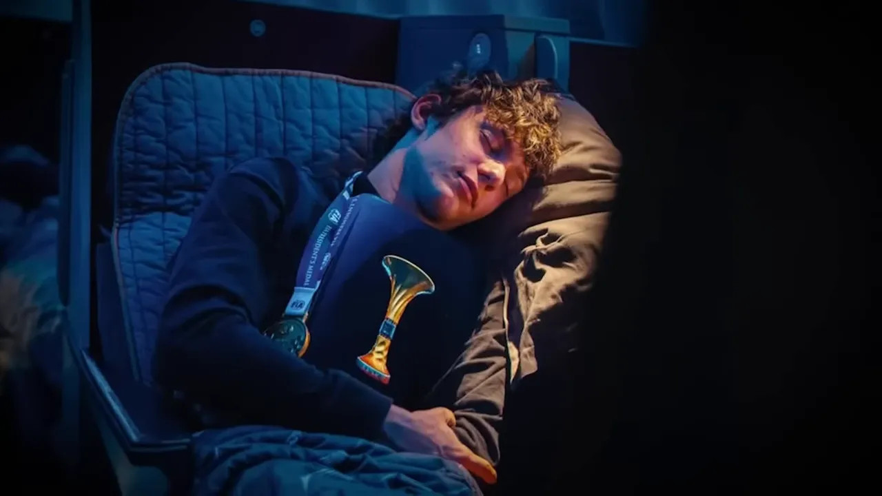 Close-up of Kimi Antonelli reclining on a flight seat