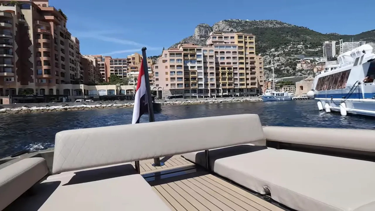 View from the stern seating area of a luxury tender leaving the marina