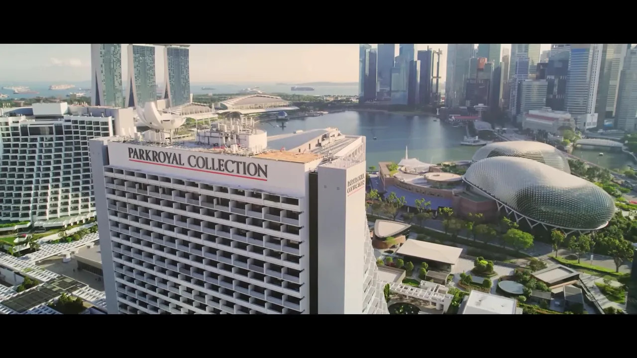 Aerial view of Parkroyal Collection Marina Bay hotel with its distinctive architecture and rooftop pool