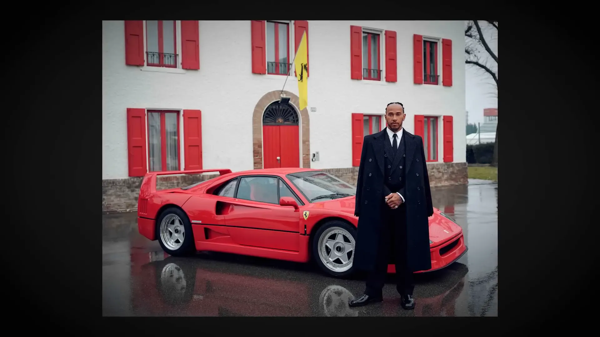 Lewis Hamilton posing next to Ferrari F40