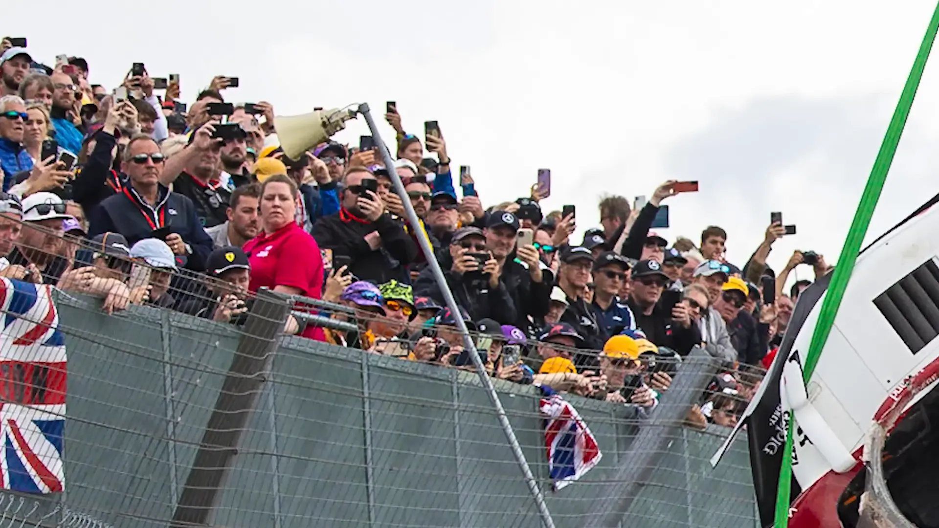 Crowd watching the car recovery operation at Silverstone
