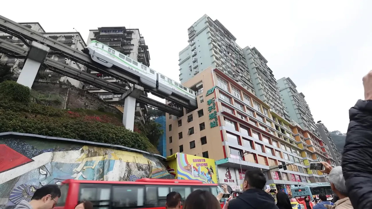 Train line passing through Chongqing residential and commercial buildings