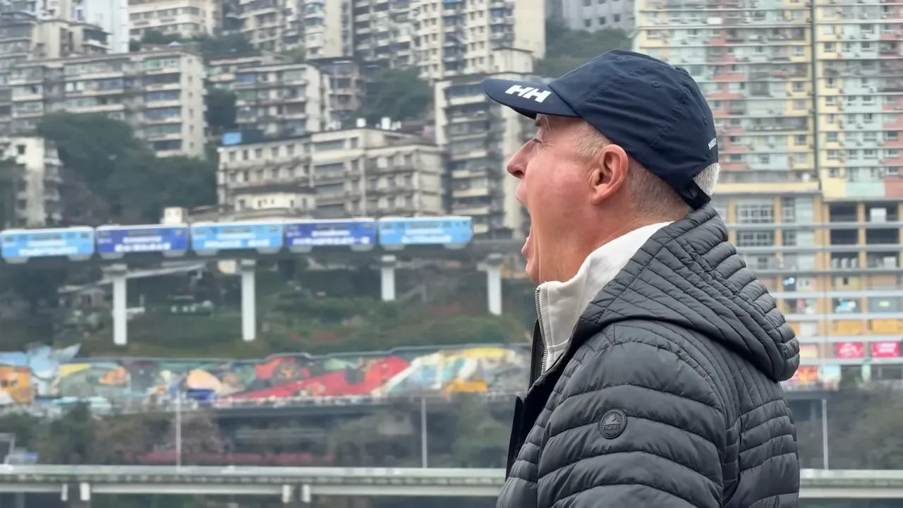 Traveler in front of Chongqing apartment buildings and river bridge view