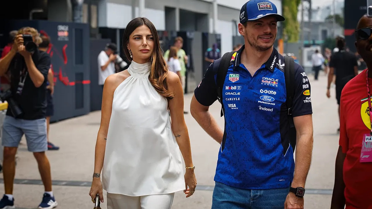 Kelly Piquet and Max Verstappen walking together through the paddock