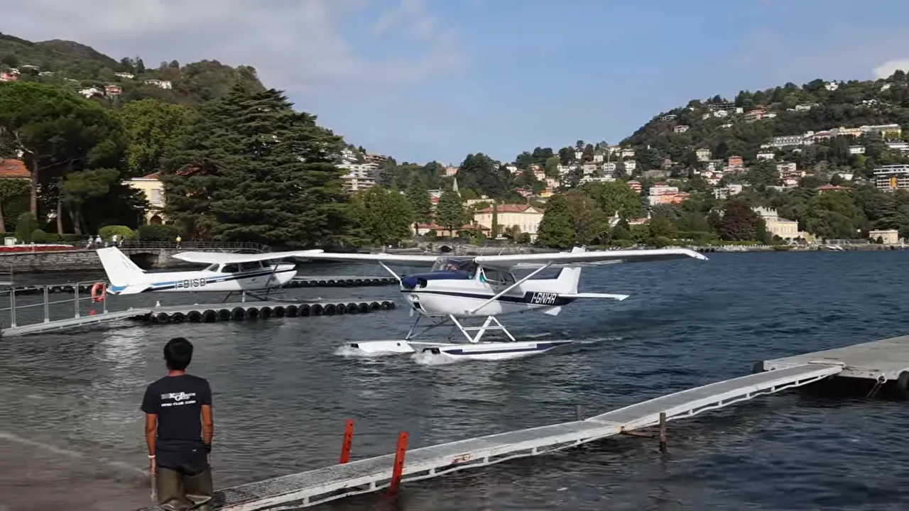 Silver seaplane sculpture beside Lake Como waterfront