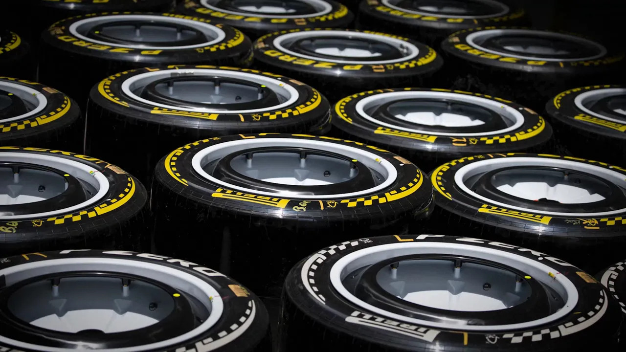 Rows of Pirelli Formula 1 tyres stacked in a storage area