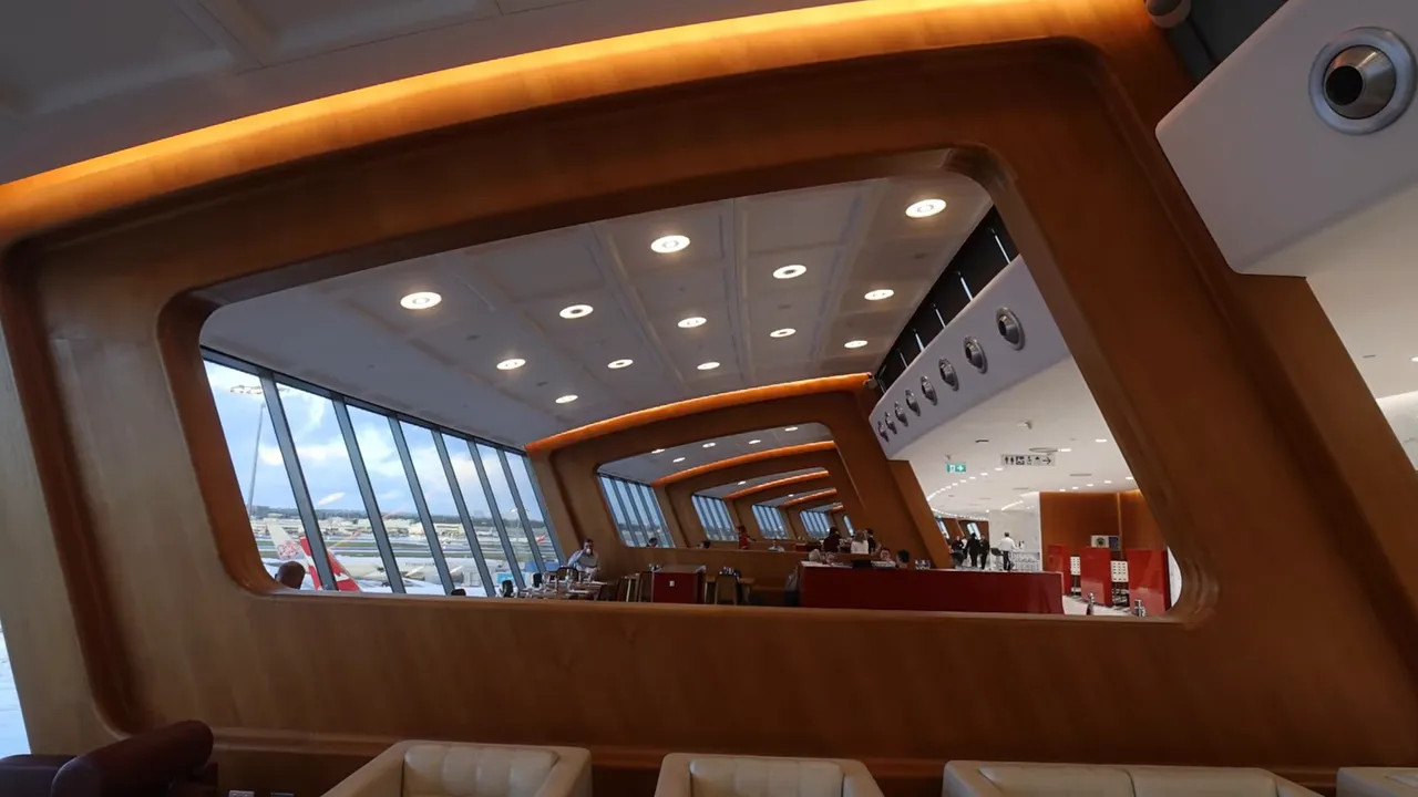 A380 upper-deck lounge window view with seating and cabin lounge area beyond