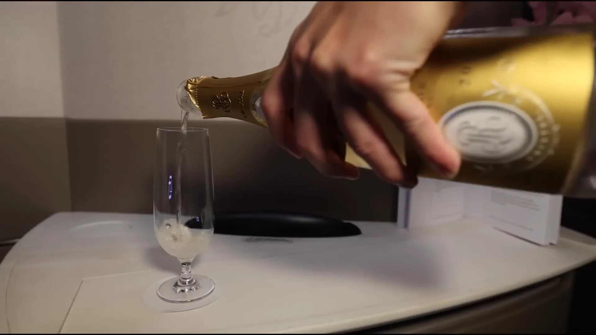 Champagne served in-flight with attention to presentation