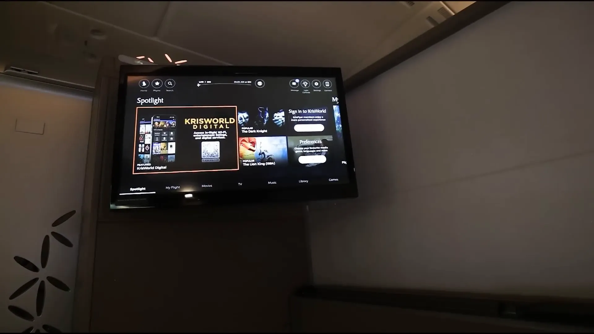 Large in-flight entertainment screen and seat controls in the suite