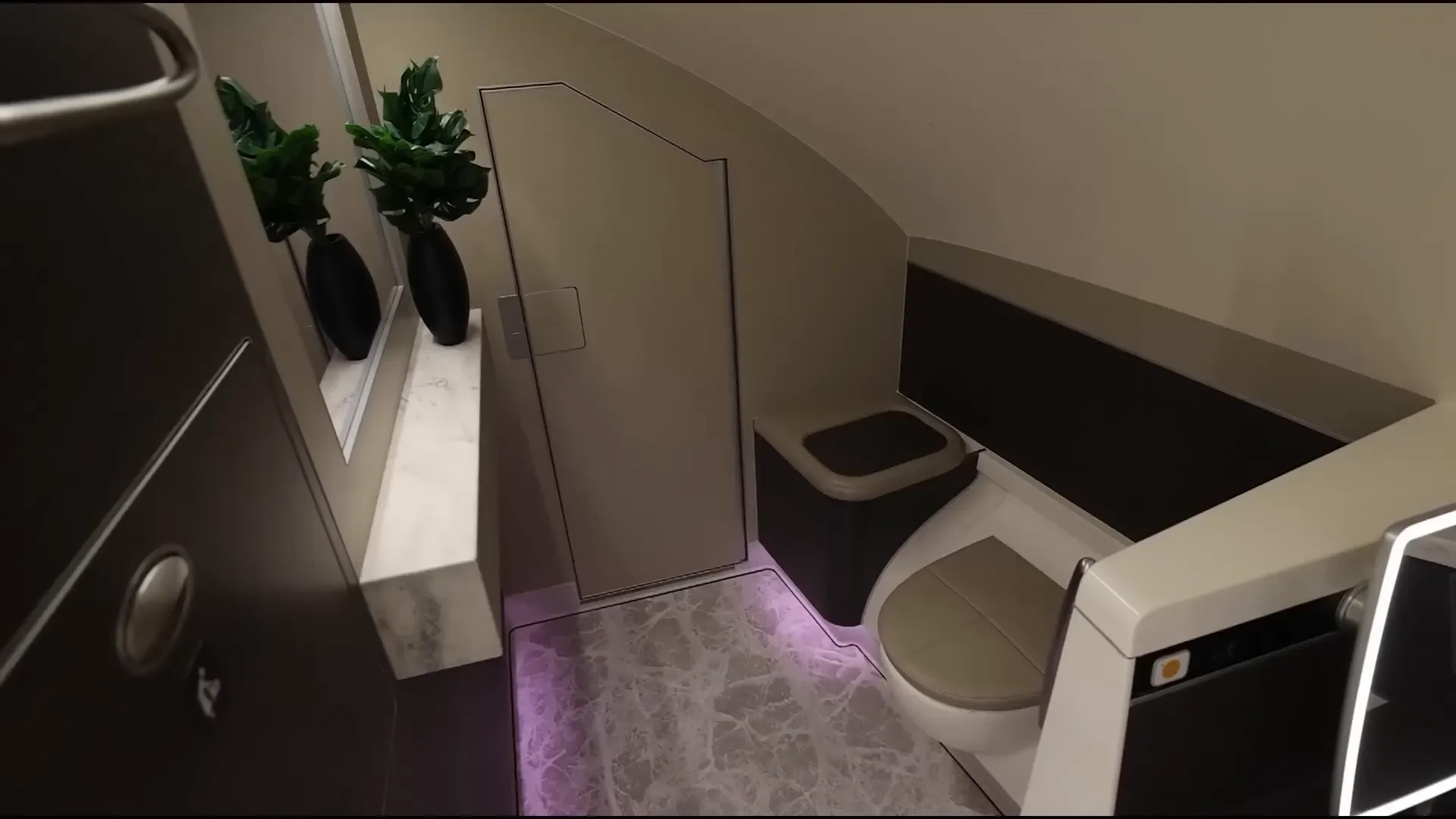 Larger first-class bathroom with full-length mirror and sit-down area