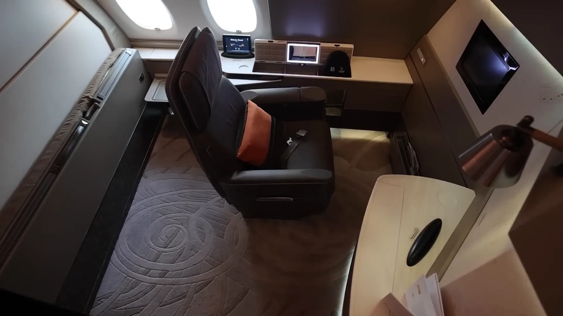 Seat rotated to face the large 32-inch TV in the suite